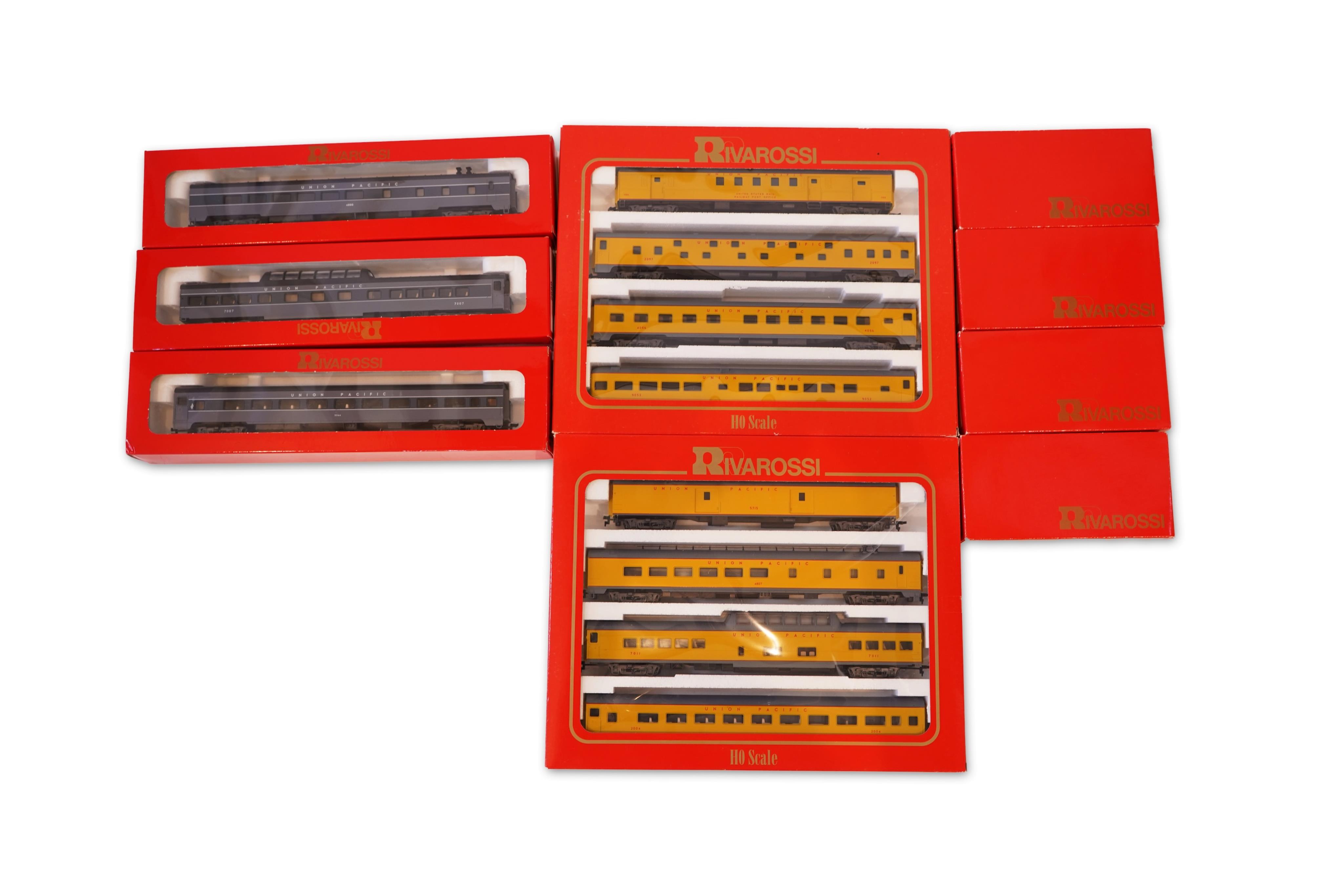 Two boxed Rivarossi 1930s Union Pacific coach packs; A Set (6964) and B Set (6965), both containing four coaches, together with three individually boxed coaches (2654, 2689 and 2814), plus four bogie freight wagons (2255
